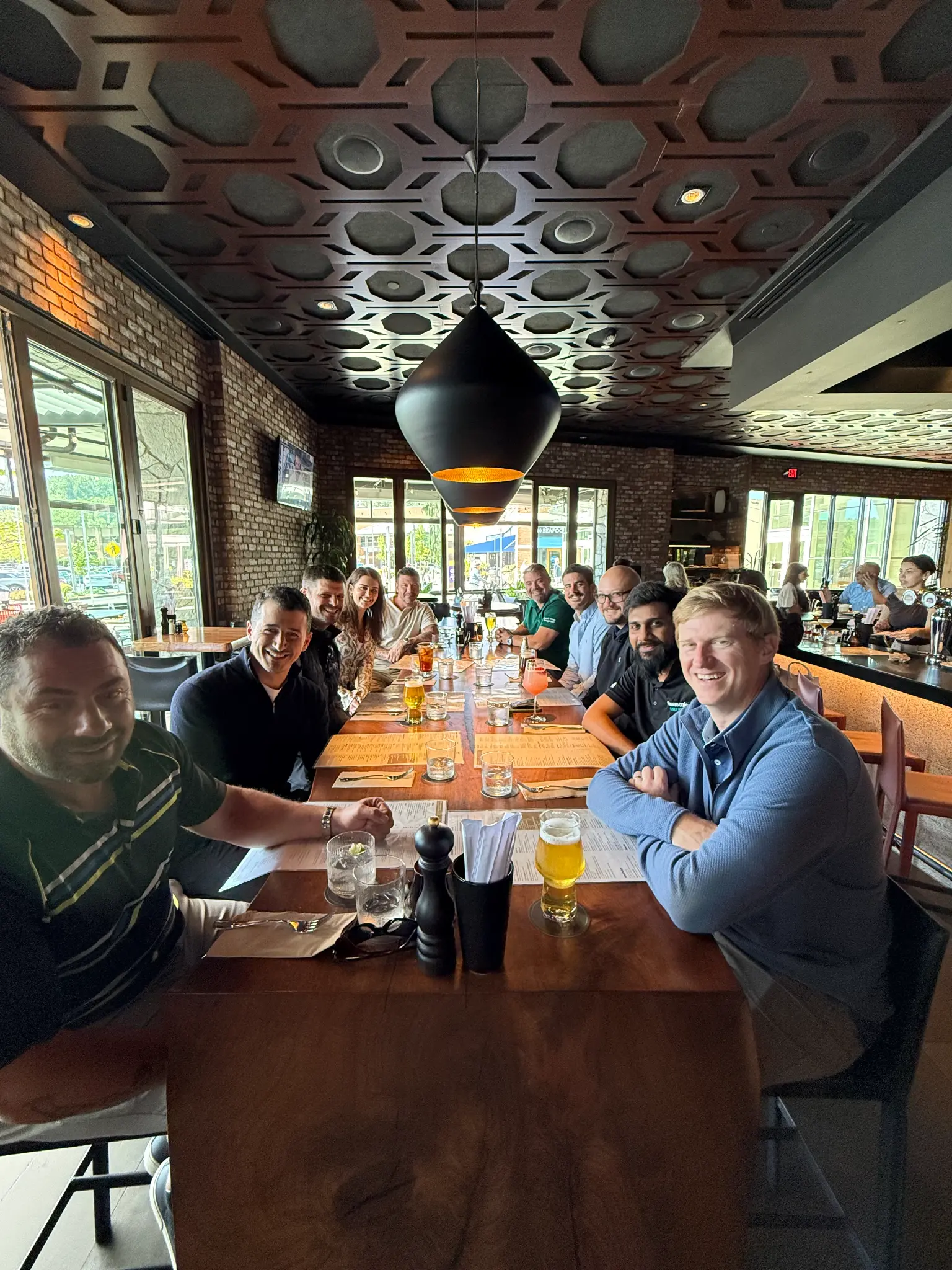 Tritan Logistics team and partners meeting after the May 11 Tukwila facility ribbon cutting.